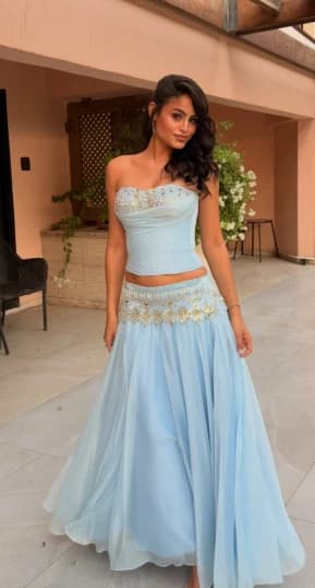 Powder blue strapless corset with crystal embroidery and a flowing chiffon skirt